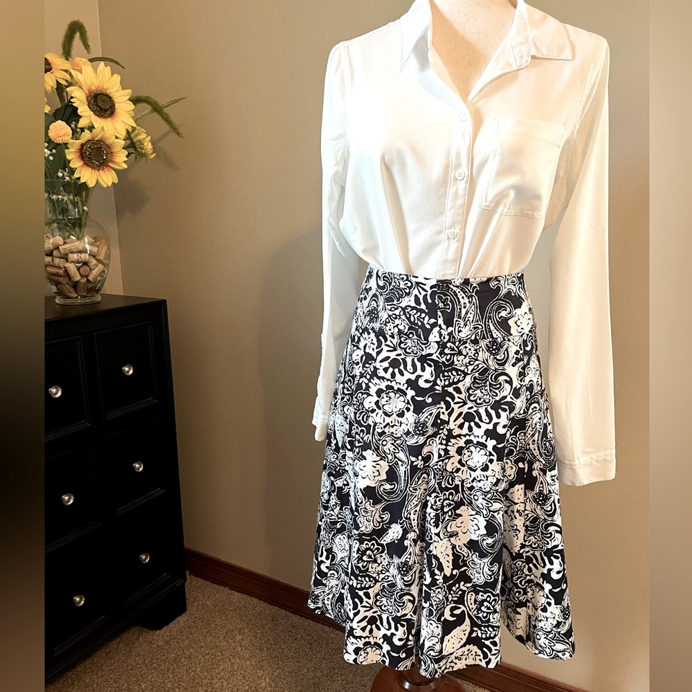 Black & white, A-line skirt drapes beautifully. Full swing skirt has 8 panels.